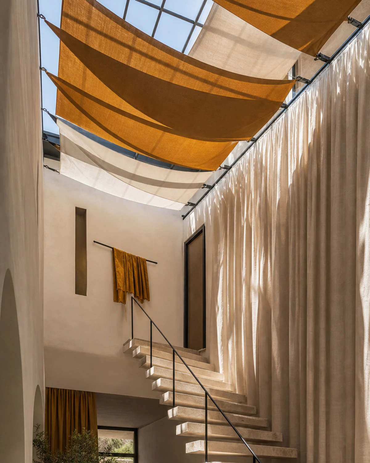 Tensioned Fabric Sails Below a Skylight — Stair atrium